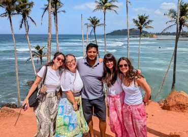 International travelers with their Chathu Lanka Tours driver-guide on Sri Lanka’s south coast