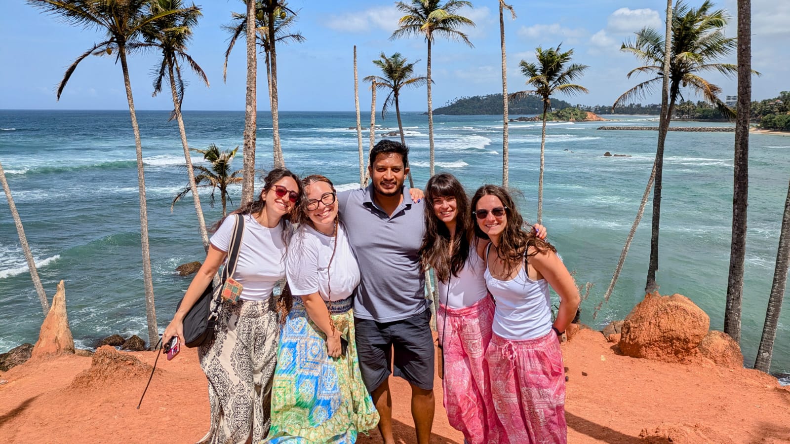 International travelers with their Chathu Lanka Tours driver-guide on Sri Lanka’s south coast