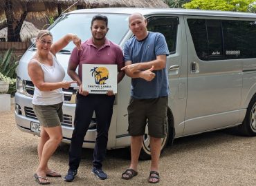 Guests with their private driver-guide and tour vehicle in Sri Lanka